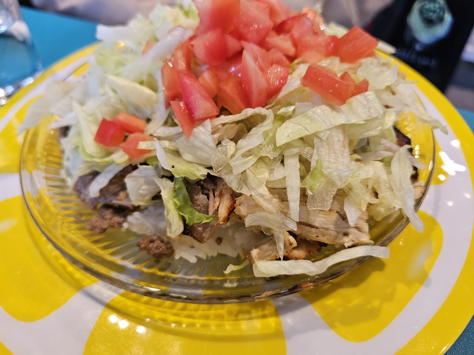 Close view of plated food on a yellow plate